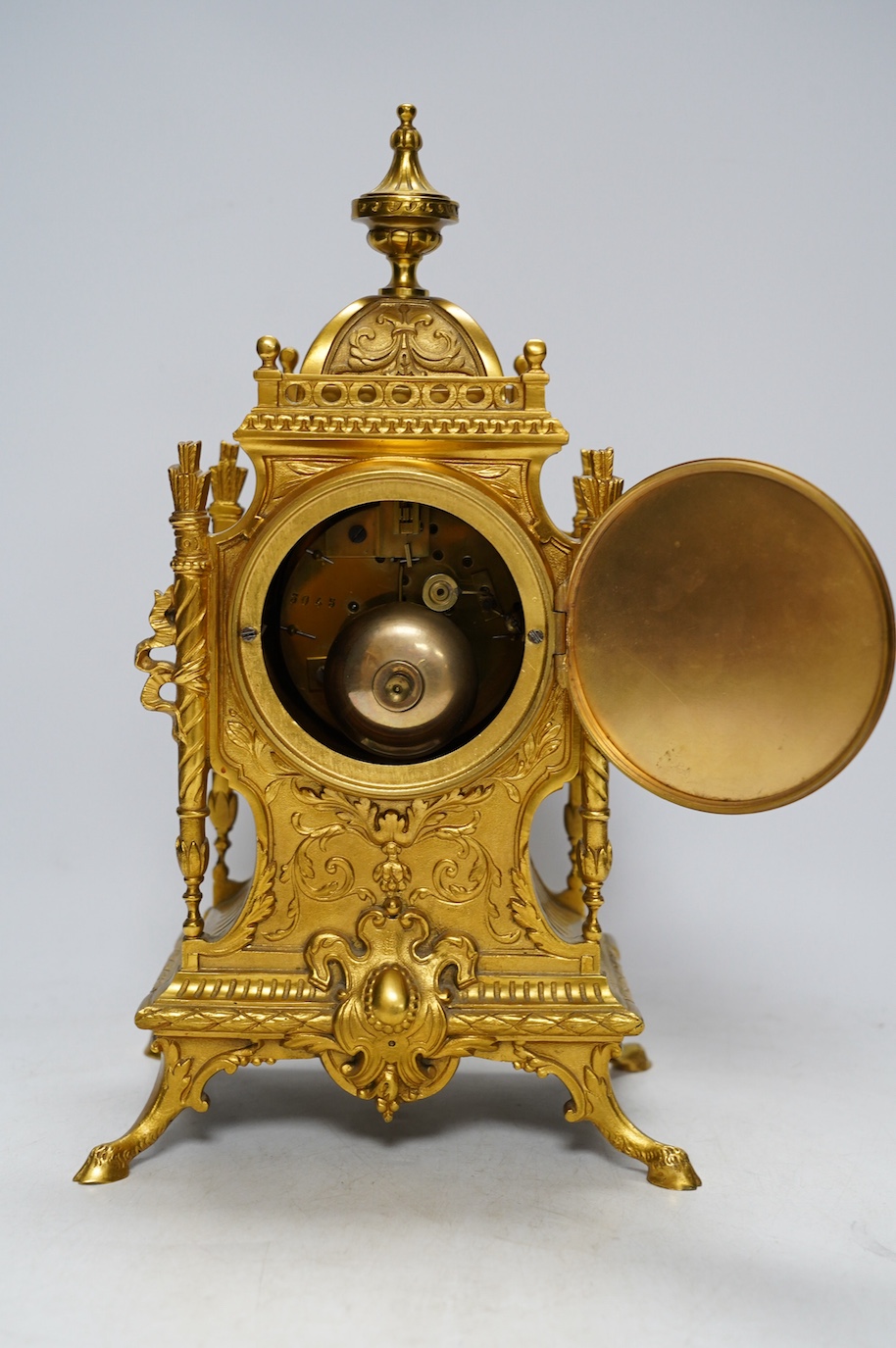 An early 20th century French ormolu mantel clock with key and pendulum, 33cm. Condition - good, not tested as working